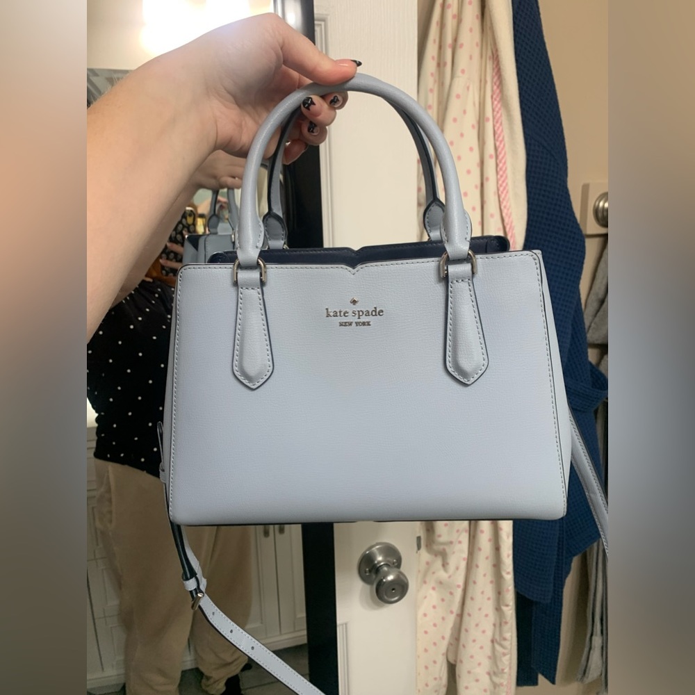 Baby blue Kate Spade handbag with crossbody strap